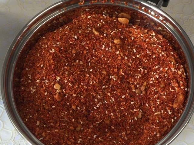 Remove spices from oil before cooling to avoid burning chili flakes when infusing.