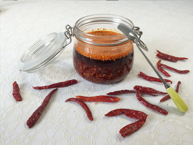 Finish chili oil with sesame seeds for added flavor and texture.