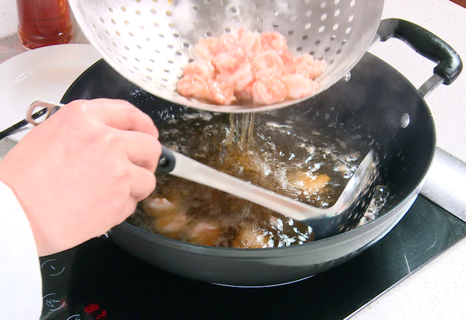 Cook shrimp in hot oil until pink, then remove from pan.