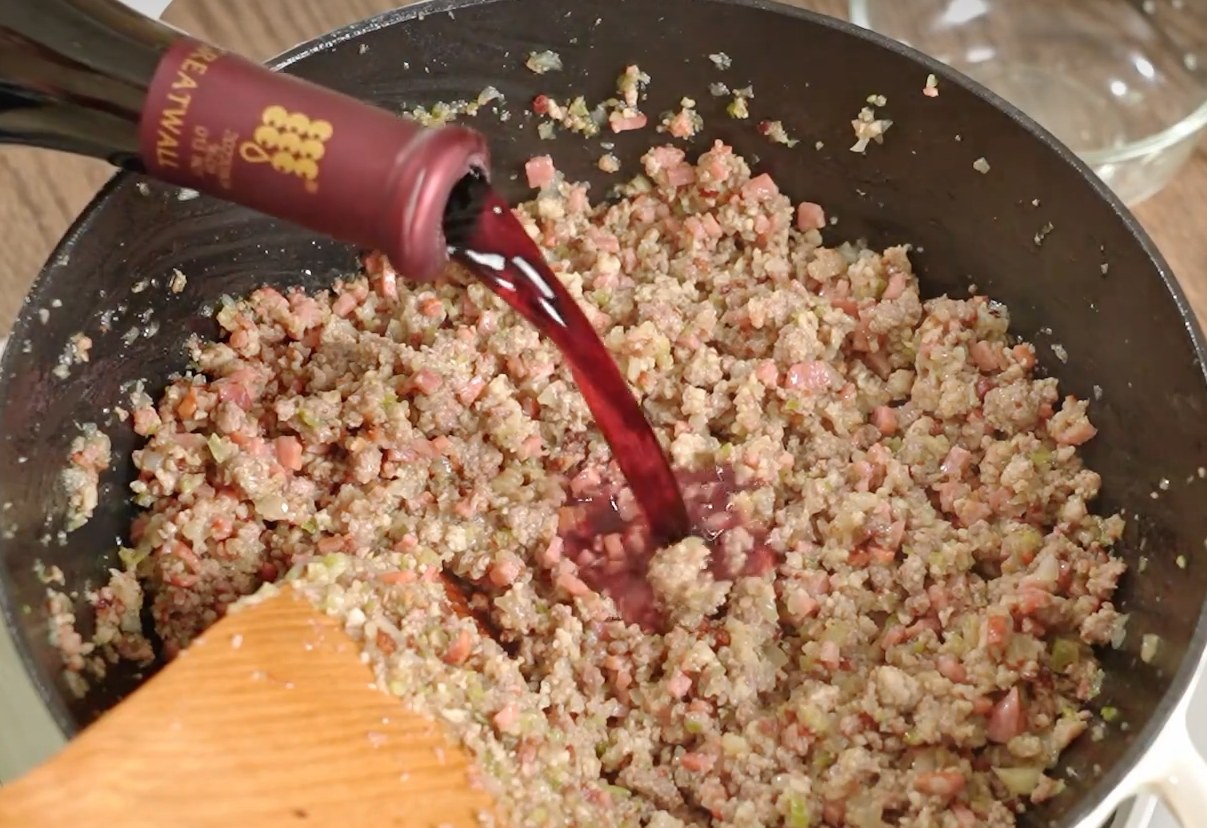 Cook red wine until absorbed (50ml).