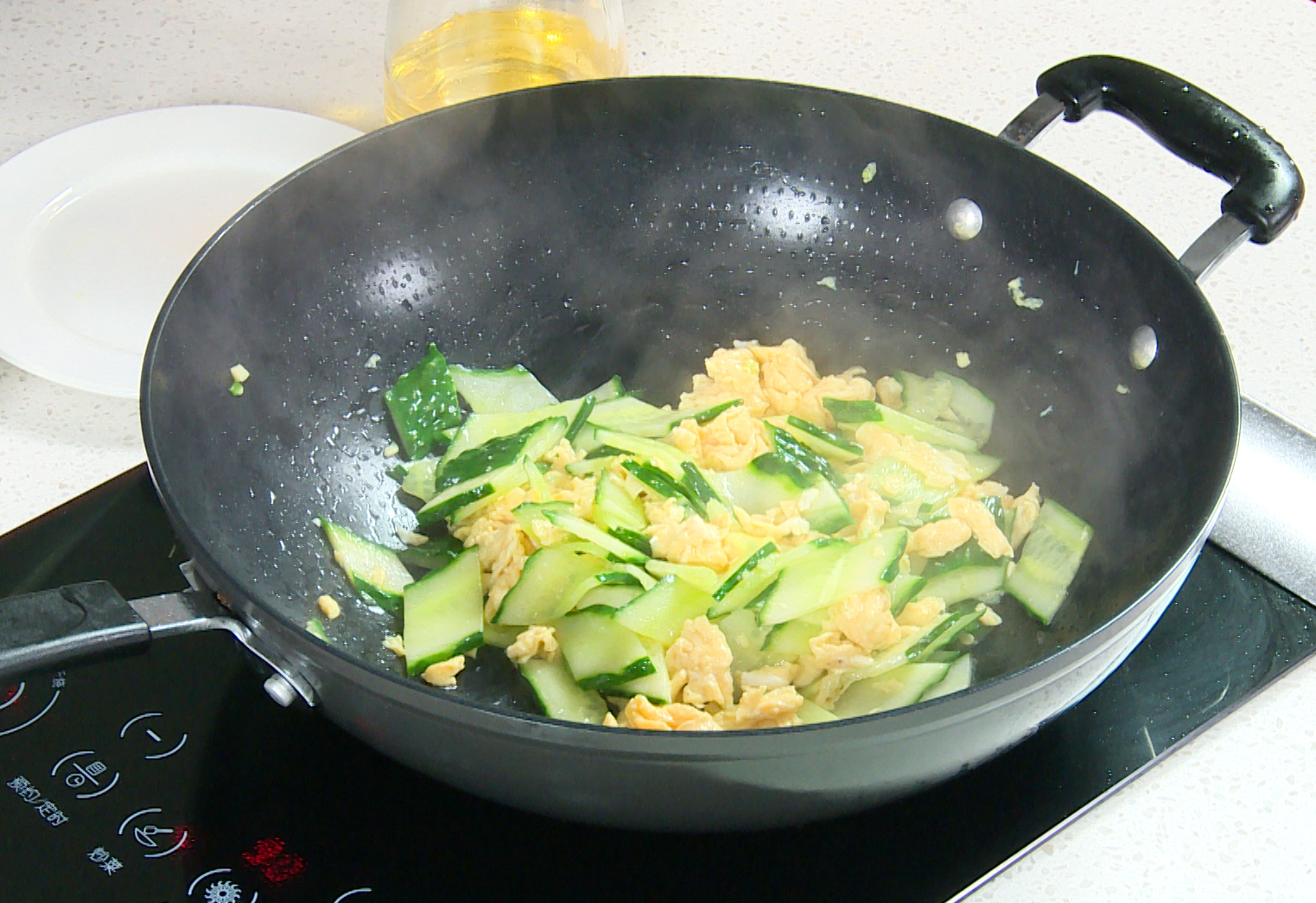 Stir-fry cucumber slices in oil until fragrant and tender, season with salt.