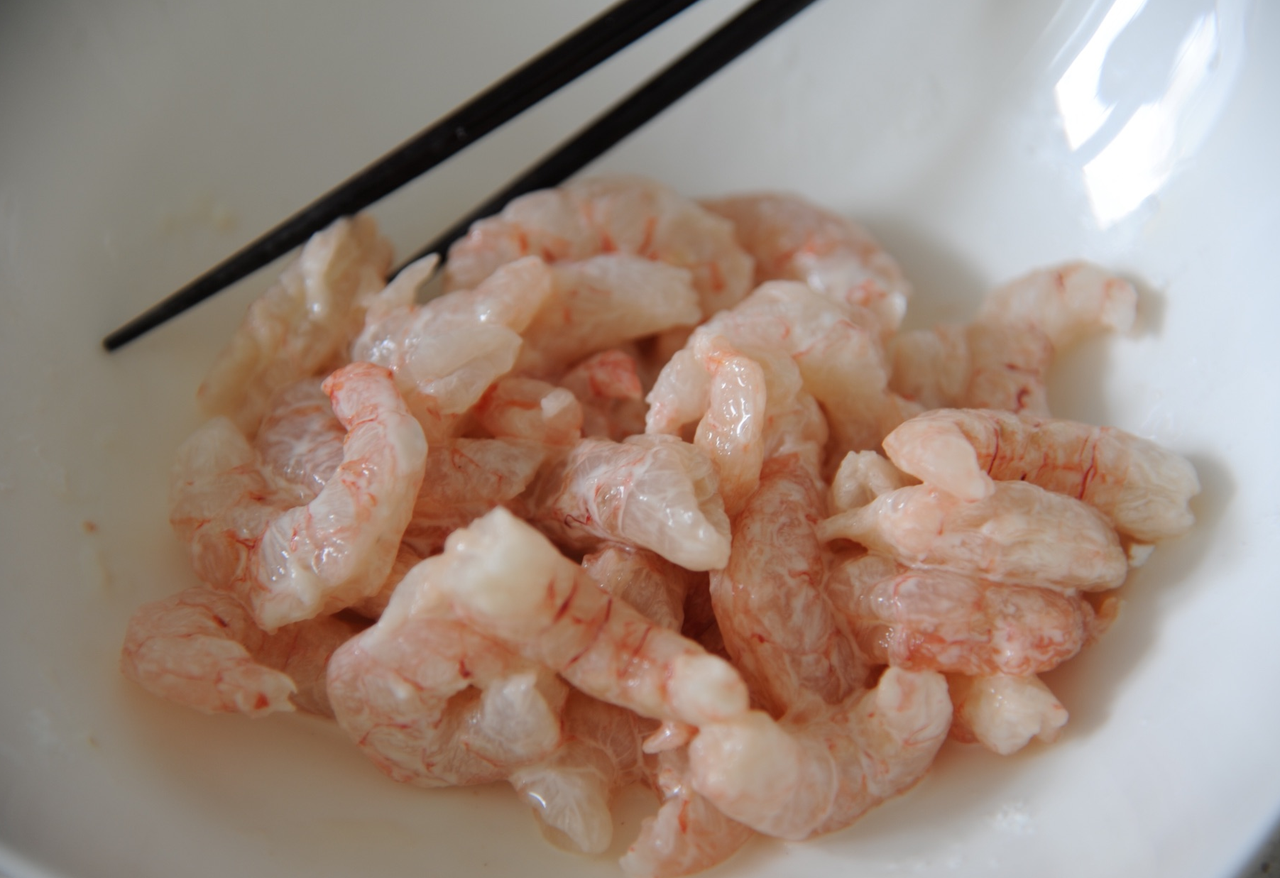 Coat shrimp evenly with cornstarch for a thorough mix.