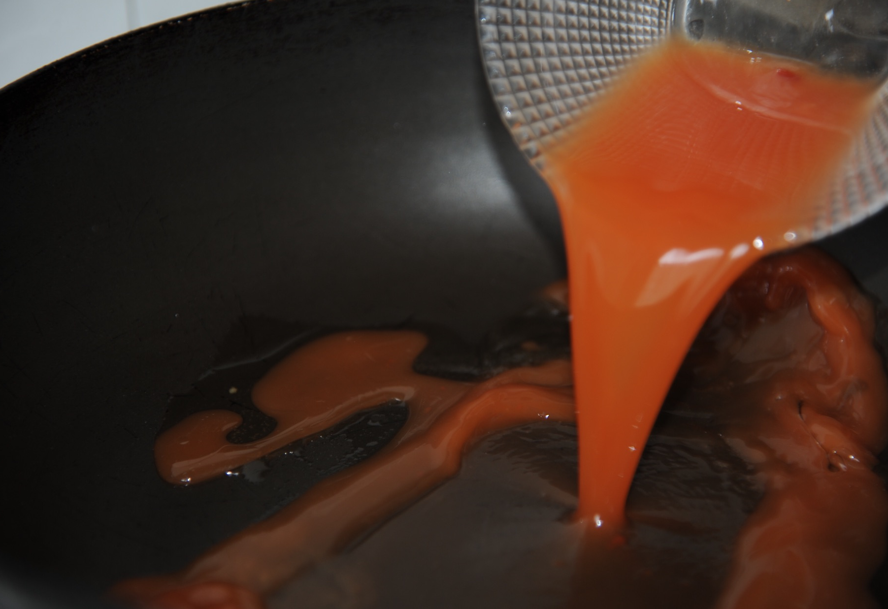 Pour prepared sauce in hot oil, stirring constantly.