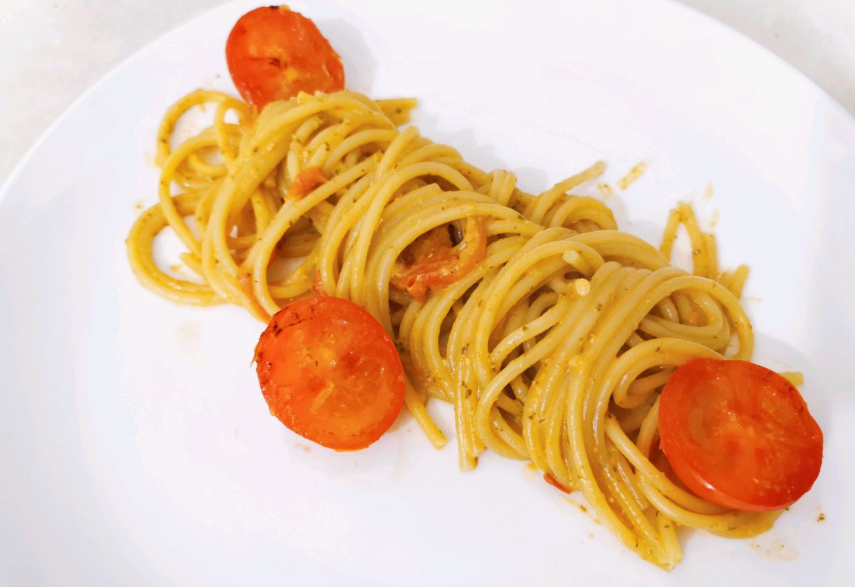 Serve spaghetti on a plate to enjoy a delicious meal.