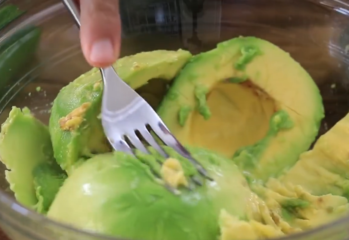 Mash avocados into a smooth consistency for recipe.