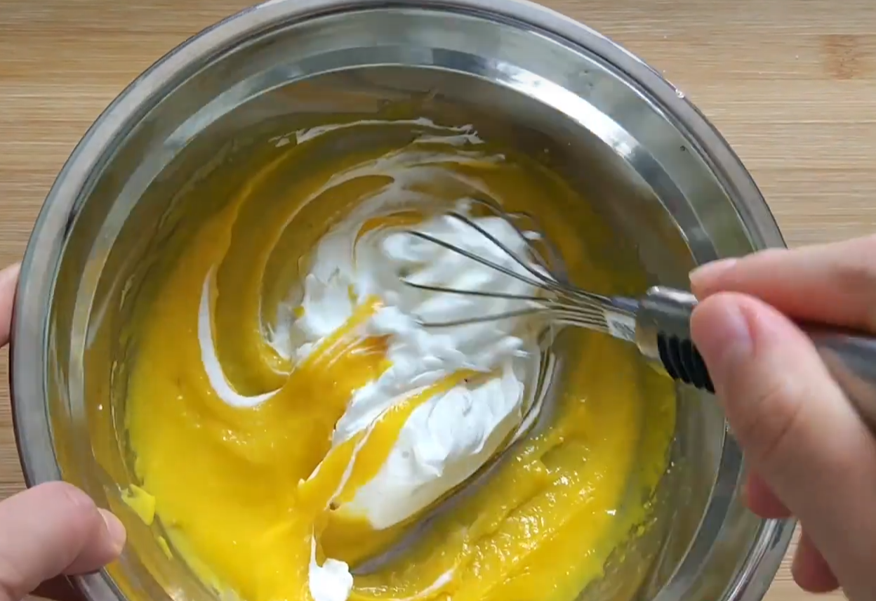 Mix egg mixture with whipped cream, folding gently until well combined.