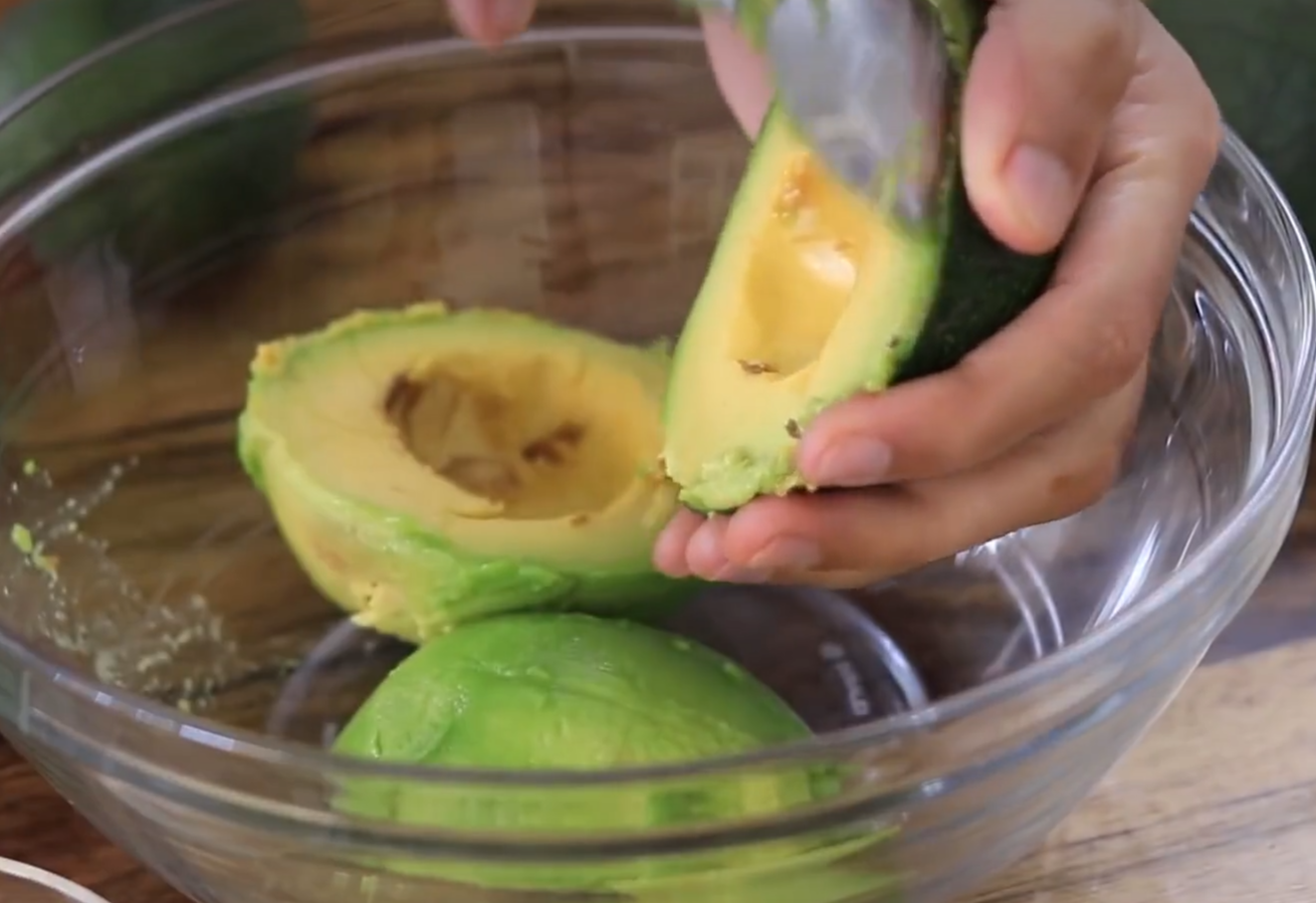 Prepare 3 ripe avocados by cutting them open and scooping out the flesh.