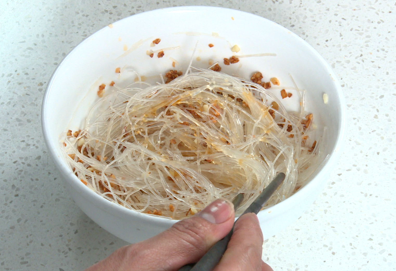 Enhance glass noodles with garlic, salt, pepper, sesame oil, and cooking oil for extra flavor.