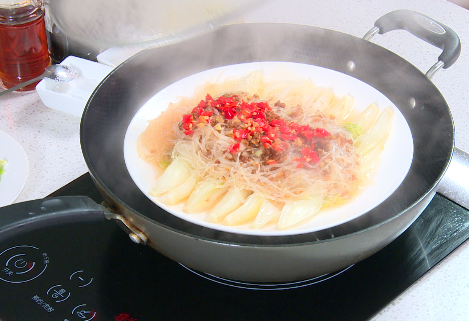 Steam dish over boiling water for 10 minutes, enhancing flavors and tenderizing baby bok choy.