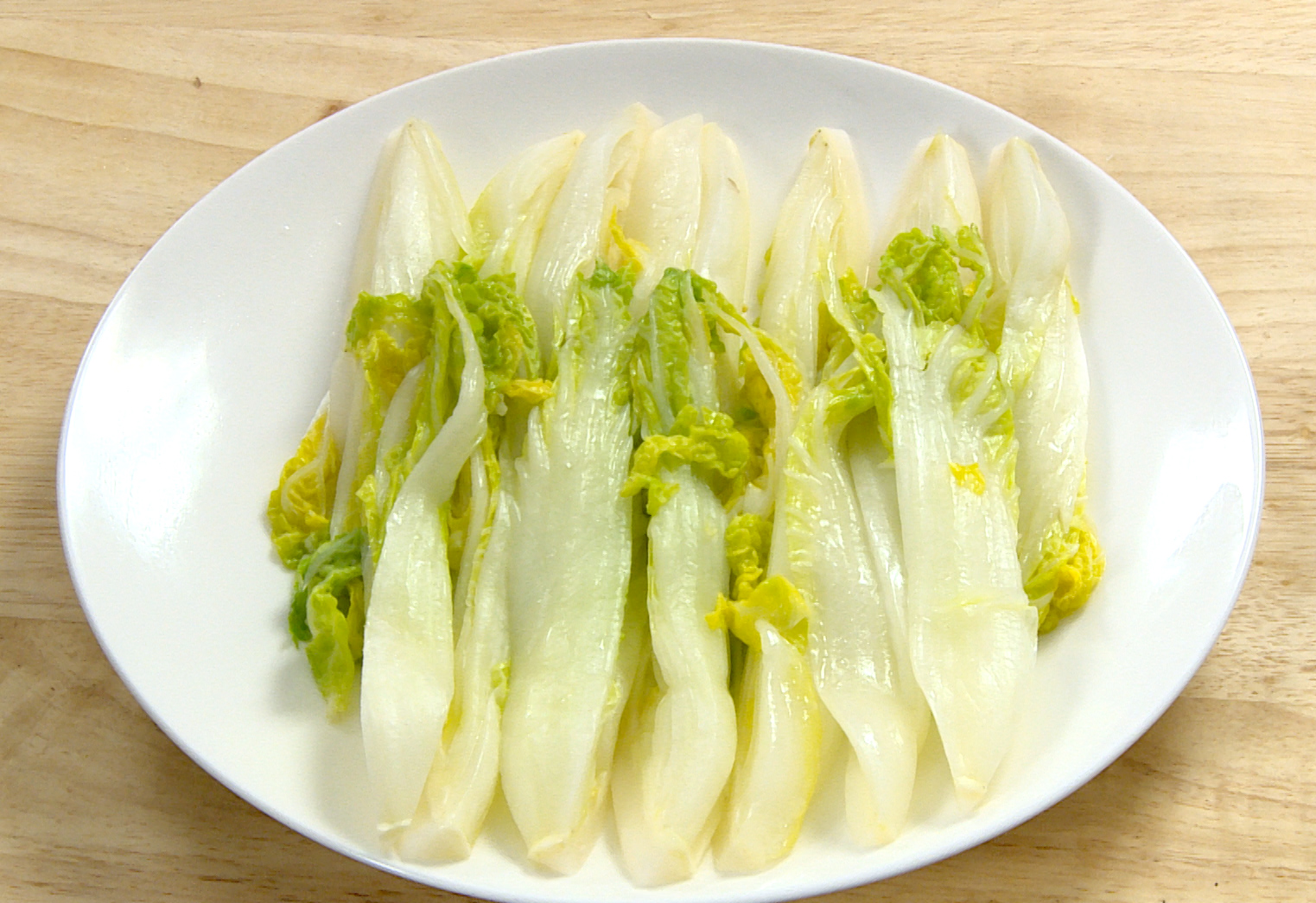 Instructions for preparing baby bok choy by blanching in salted water.