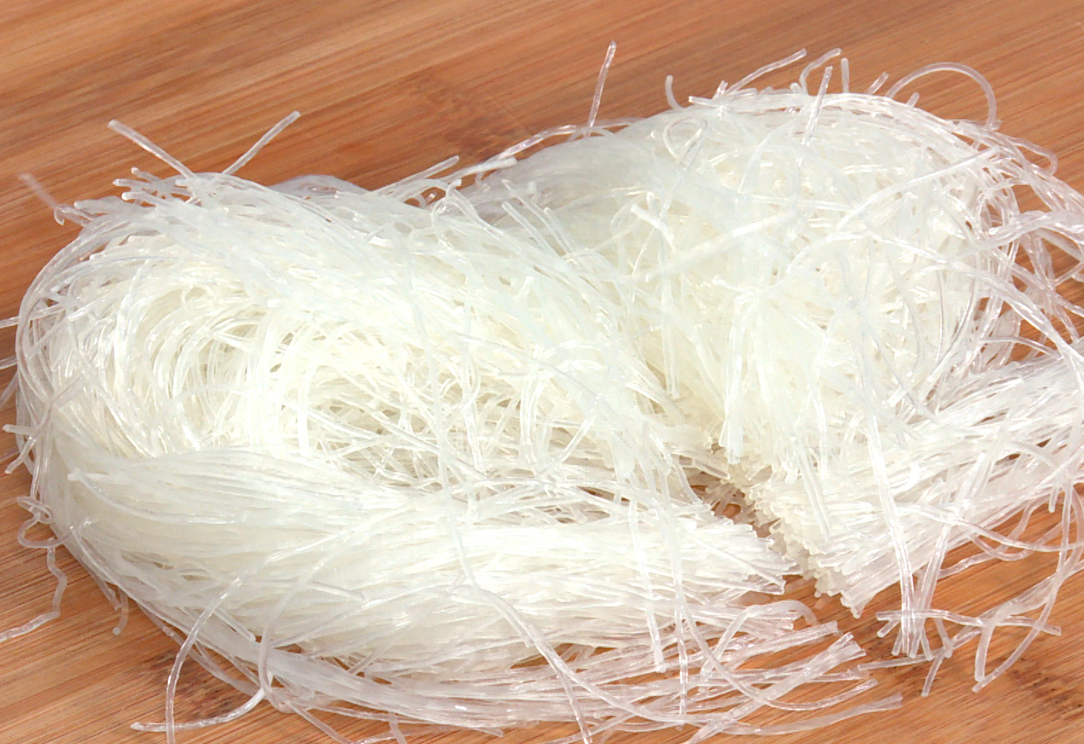 Soak glass noodles in warm water for 10 mins, cut into shorter lengths.