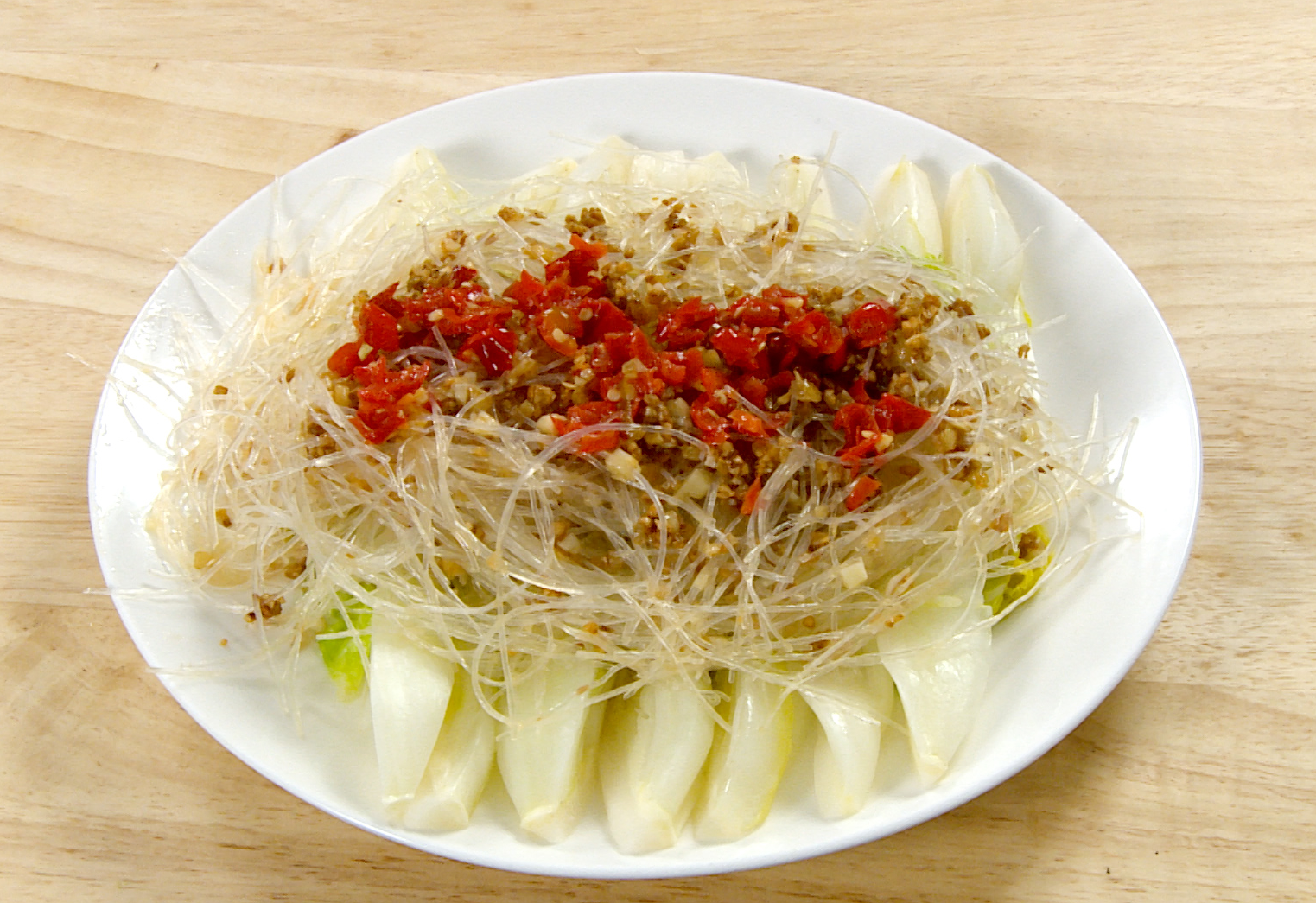 Assemble dish: Glass noodles on bok choy, add chili for heat (adjust to taste).