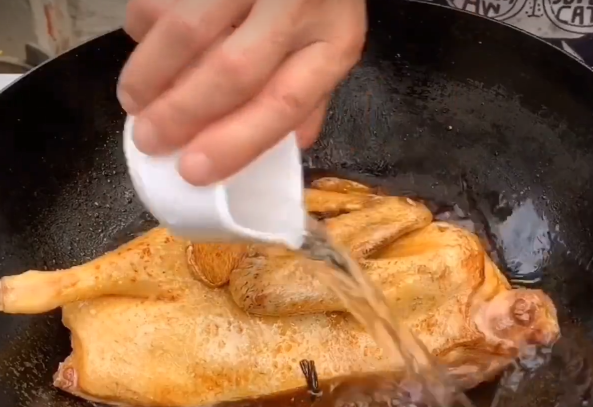 Add water to simmer duck sauce & ensure even coloring by ladling during cooking.