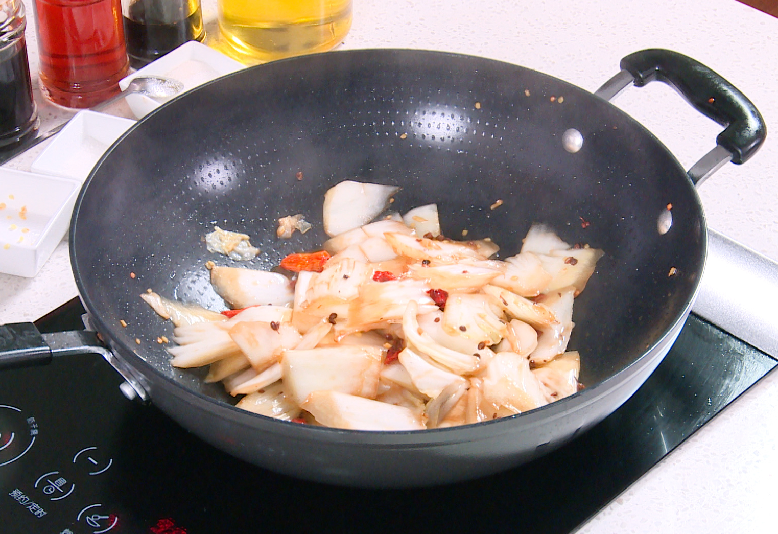 Season stir-fry with salt, sugar, soy sauce. Add vinegar for tang. Stir quickly to blend well.