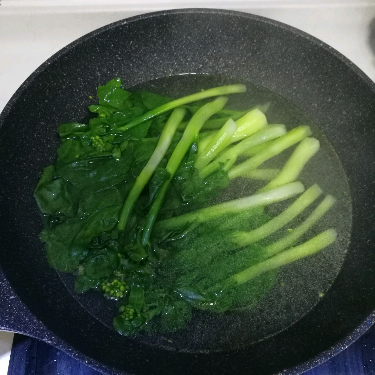 Cook Kai-lan in boiling water for 3 minutes, then drain.