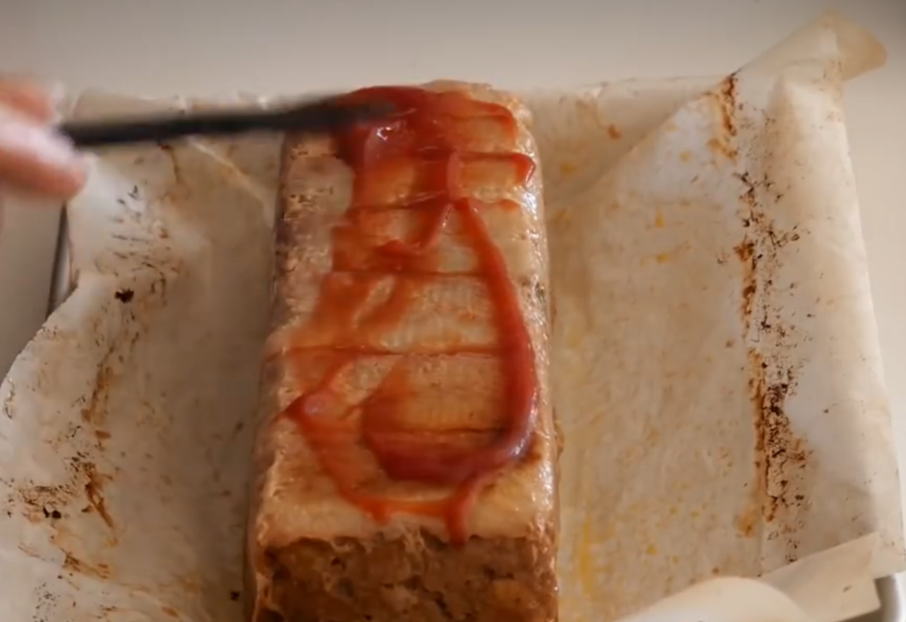 Brush 1 tbsp of ketchup on meatloaf after baking for 20 minutes.