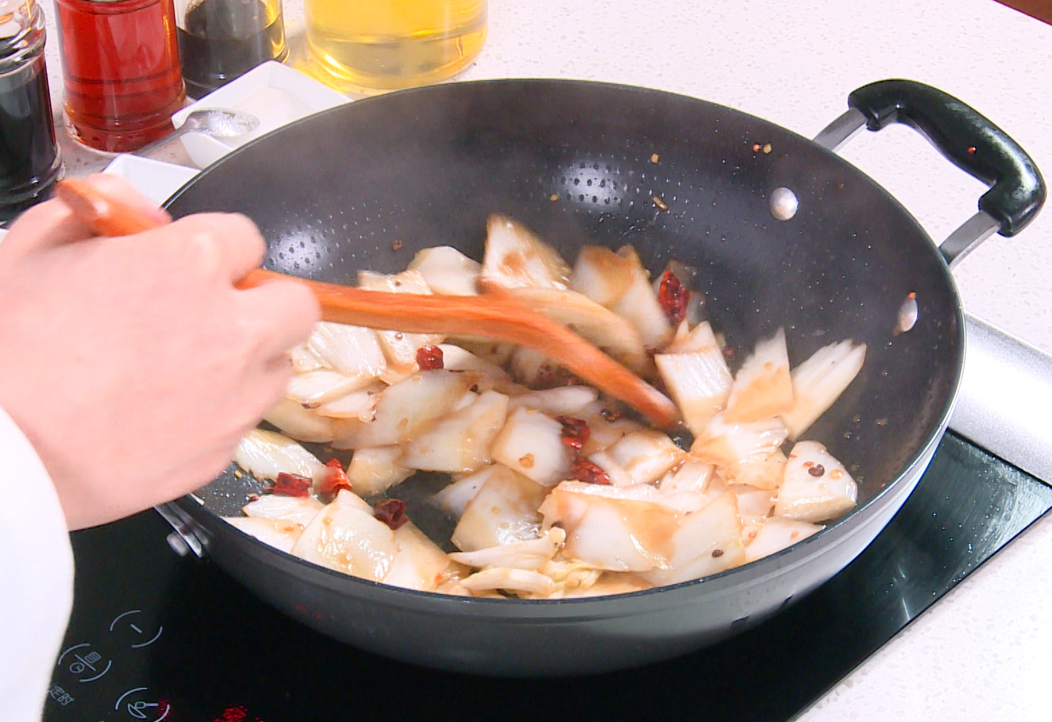 Thicken cabbage sauce with cornstarch slurry and water, stirring for 1 minute.