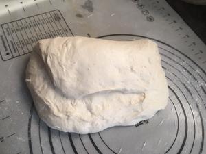 Flatten and fold fermented dough on a floured surface as directed.