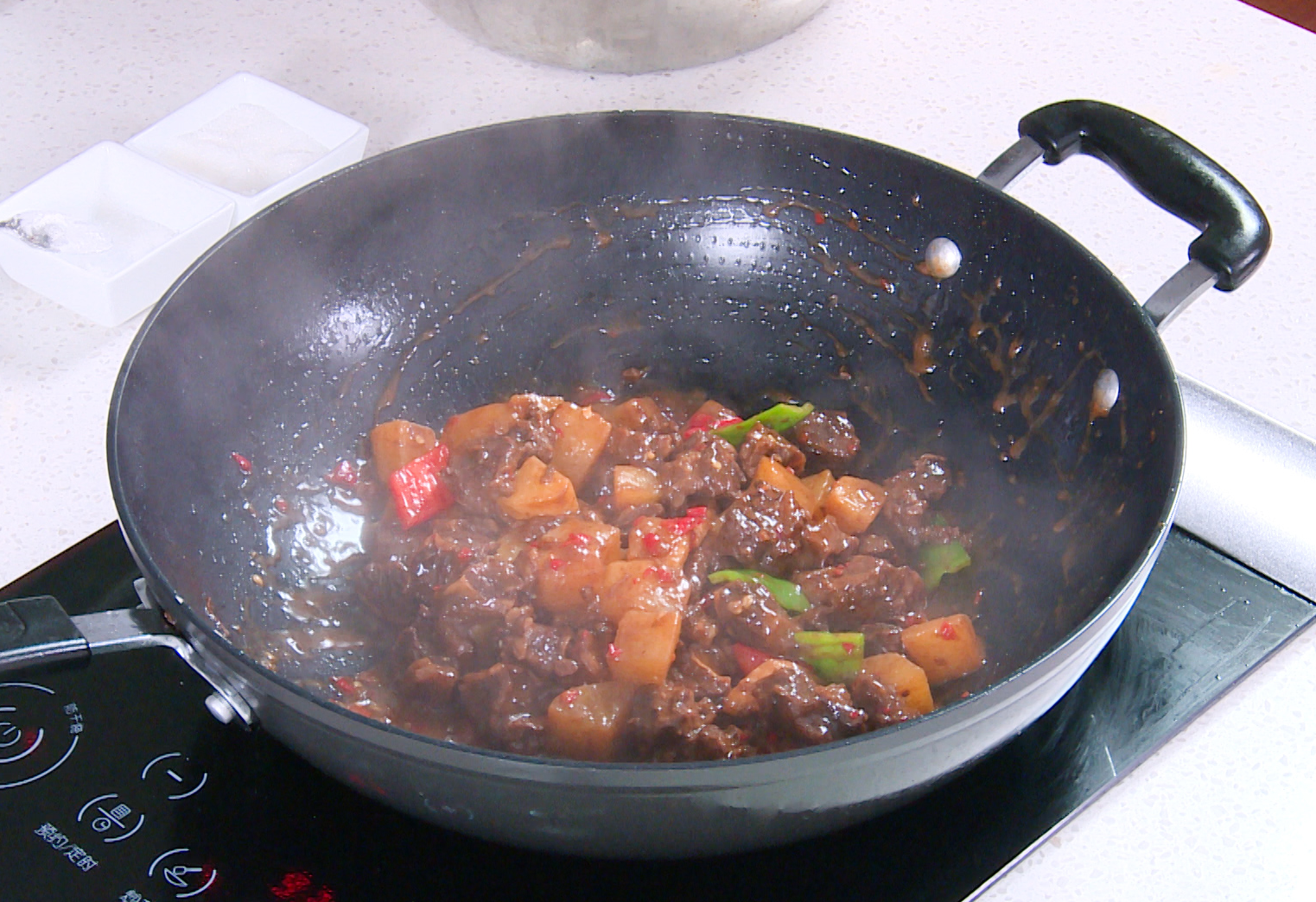 Thicken sauce by adding cornstarch slurry and stirring until desired consistency.