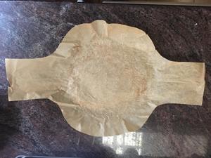 Trim parchment paper to fit cast iron pot size.