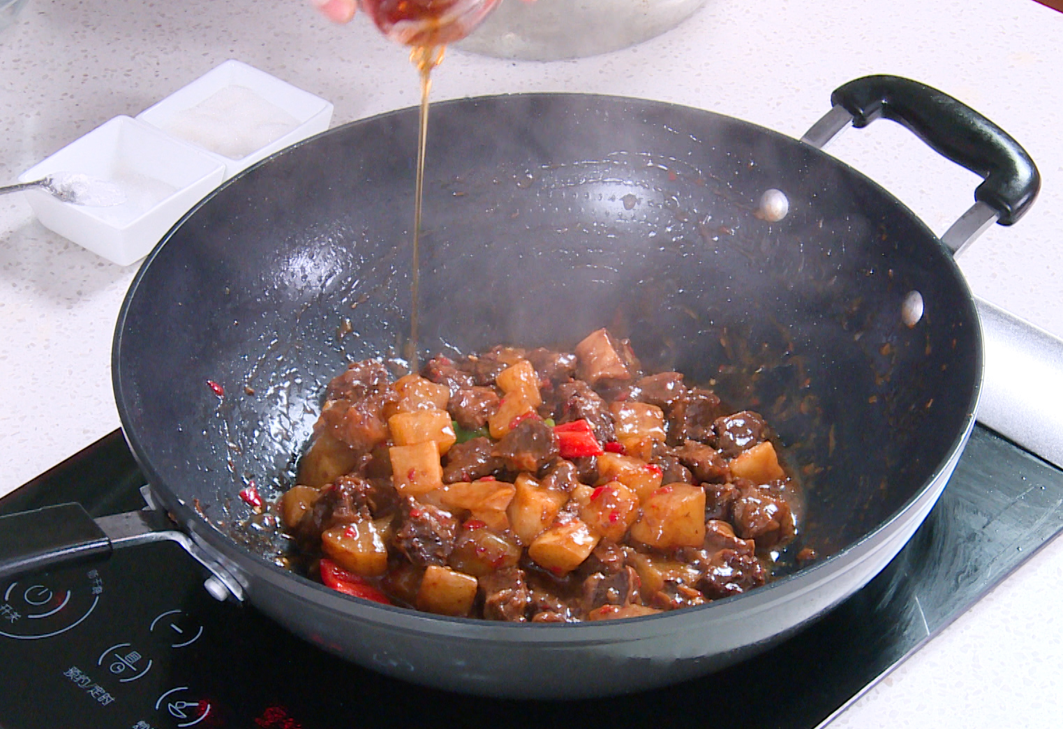 Add oils, stir, and serve hot with steamed rice.