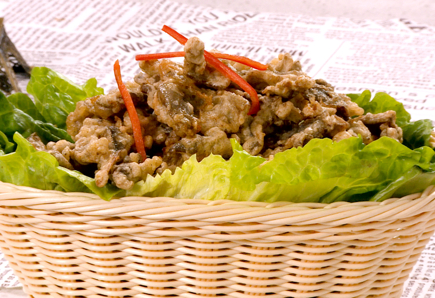 Fried oyster mushrooms: drain, serve on lettuce with chili garnish. Best served crispy.