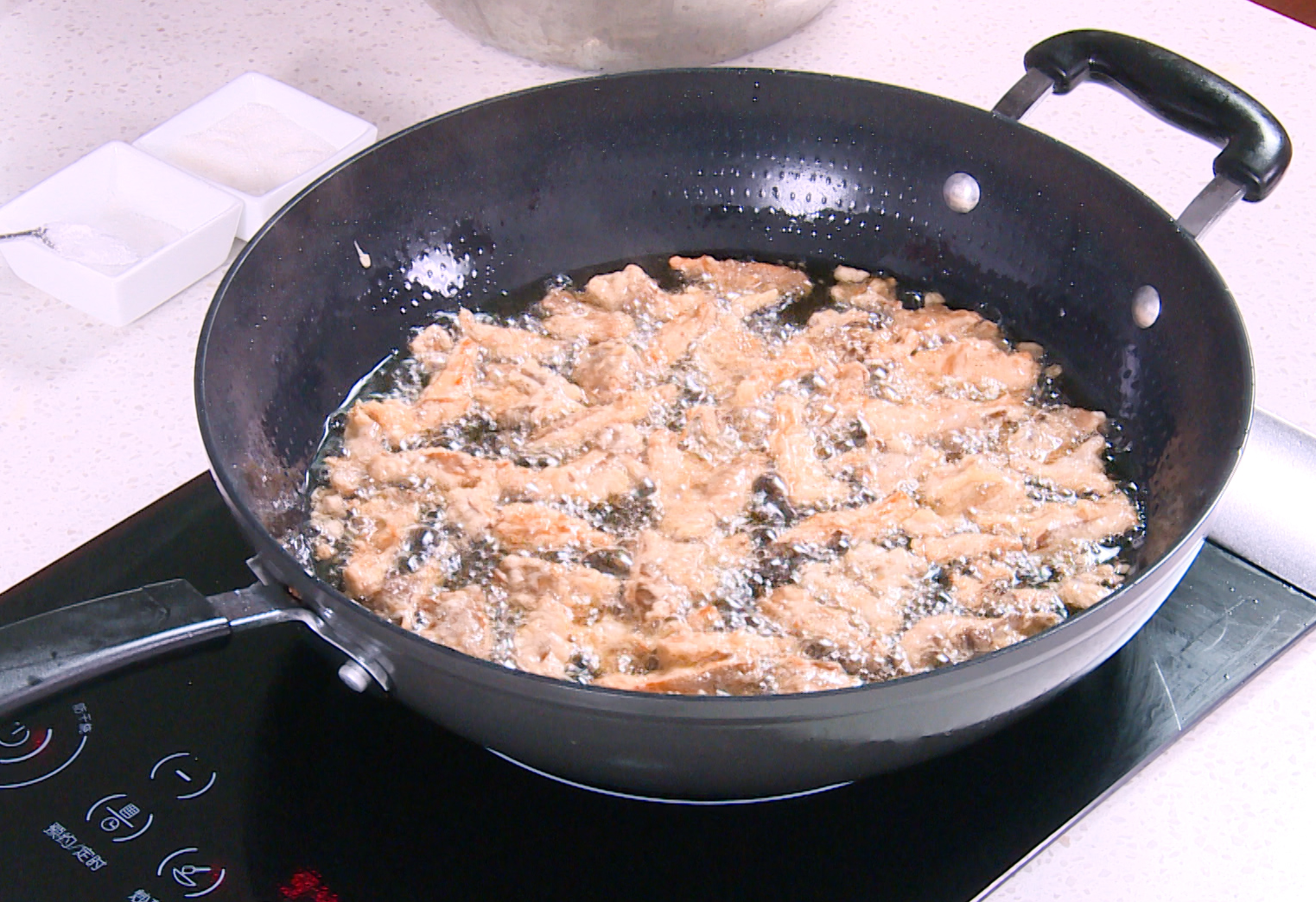 Fry oyster mushrooms in batches for 2-3 min each side until golden and crispy. Avoid overcrowding the pan. Batch frying is important to maintain oil temperature.