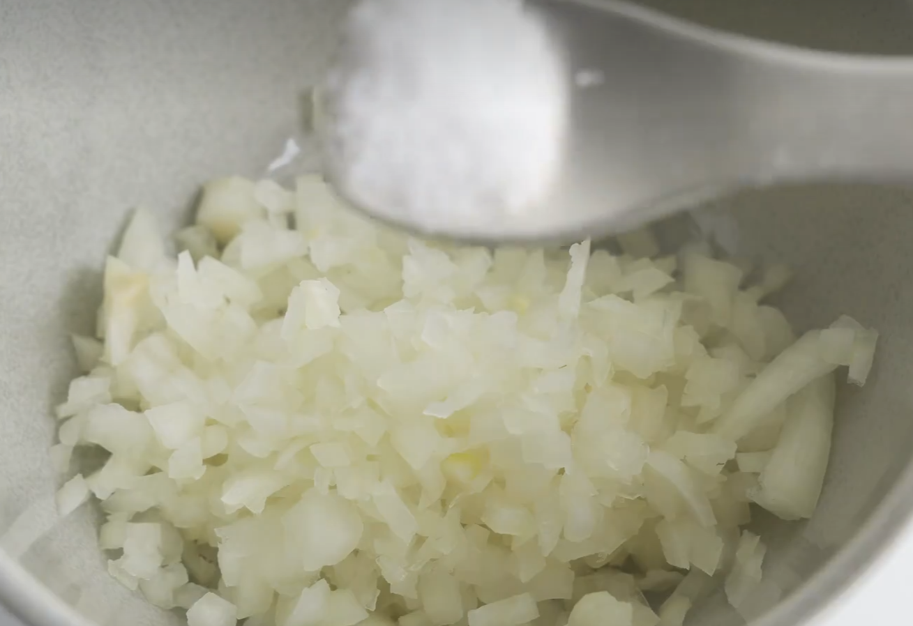 Add salt to onions to reduce moisture & pungency. Wait 15 minutes.