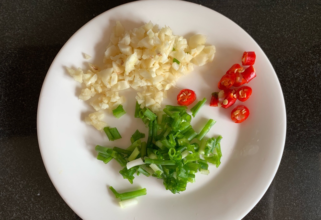 scallions and bird's eye chilies and garlic.