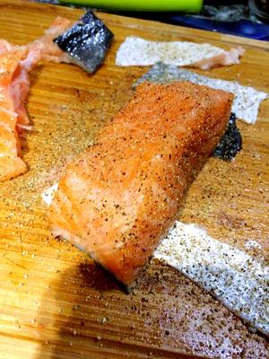 Place the salmon in the pan skin-side