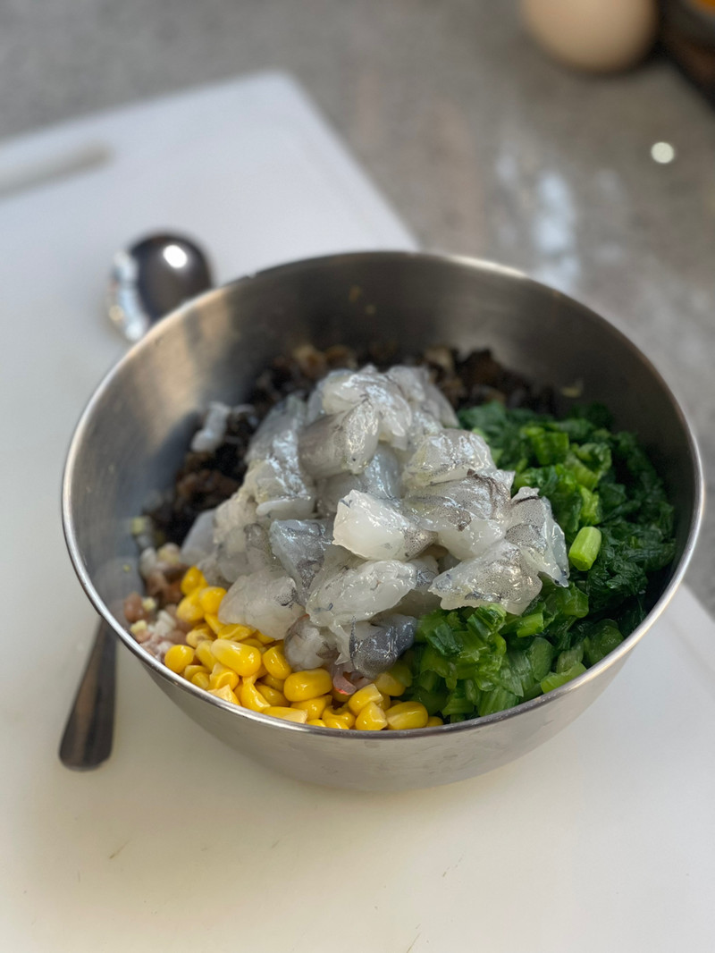 shrimp, corn kernels, bok choy, green onions with the ground pork.