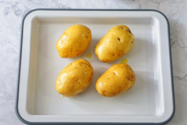 Rub the potatoes with olive oil