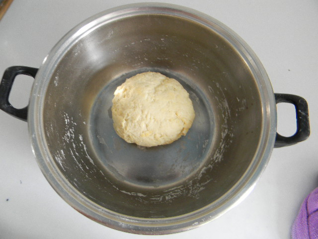 Gradually add about 70g of warm water to the flour mixture