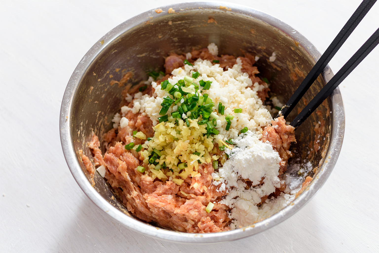 the pork mixture and the chopped green onion, ginger