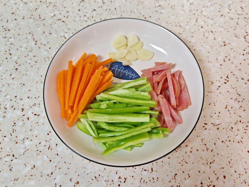 the vegetables: carrot, luncheon meat, garlic, green pepper.