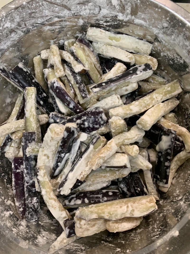 coat the eggplant strips with flour