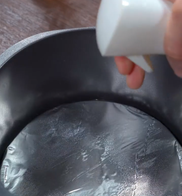 Place tin foil in the air fryer and spray a layer of oil on it