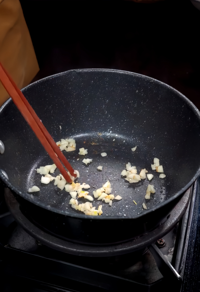 Spray a small amount of cooking oil on the hot pan