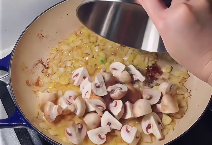 Stir-fry onions and mushrooms